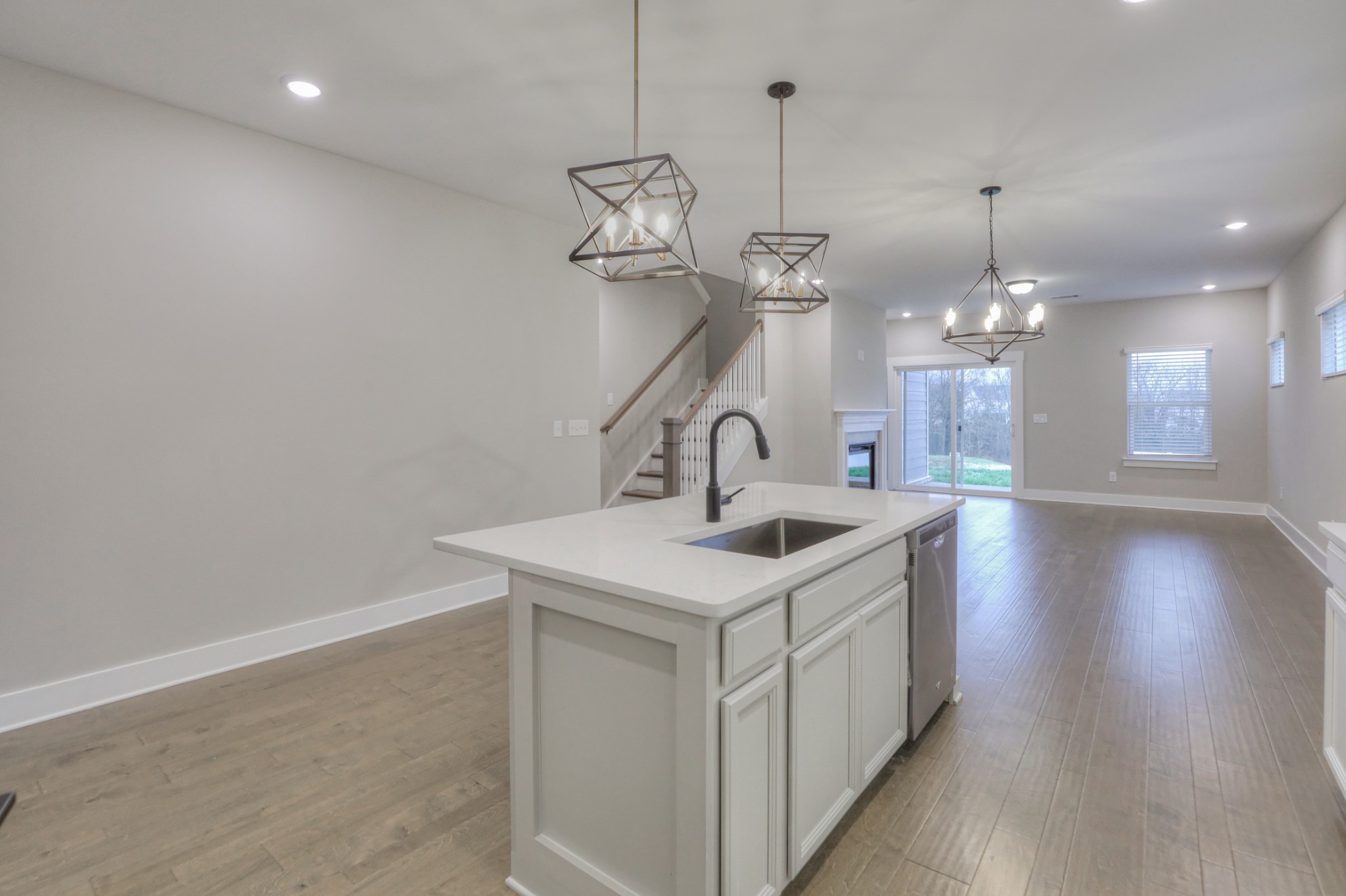 724 Castle Road Mount Juliet, TN 37122 - Photo 15 of 52 a kitchen with a sink chandelier and a stove