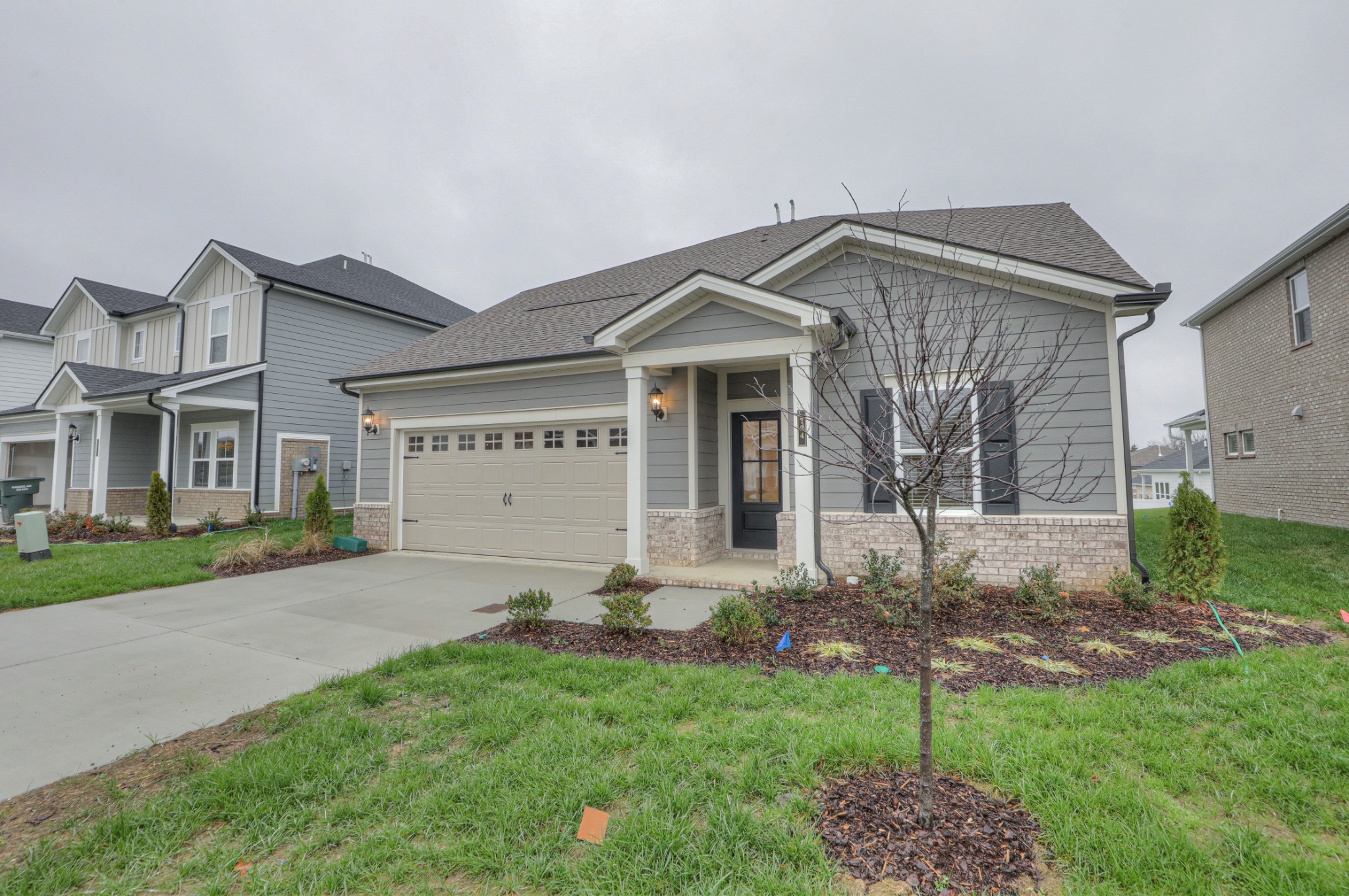 724 Castle Road Mount Juliet, TN 37122 - Photo 2 of 52 a view of a house with a yard and garden