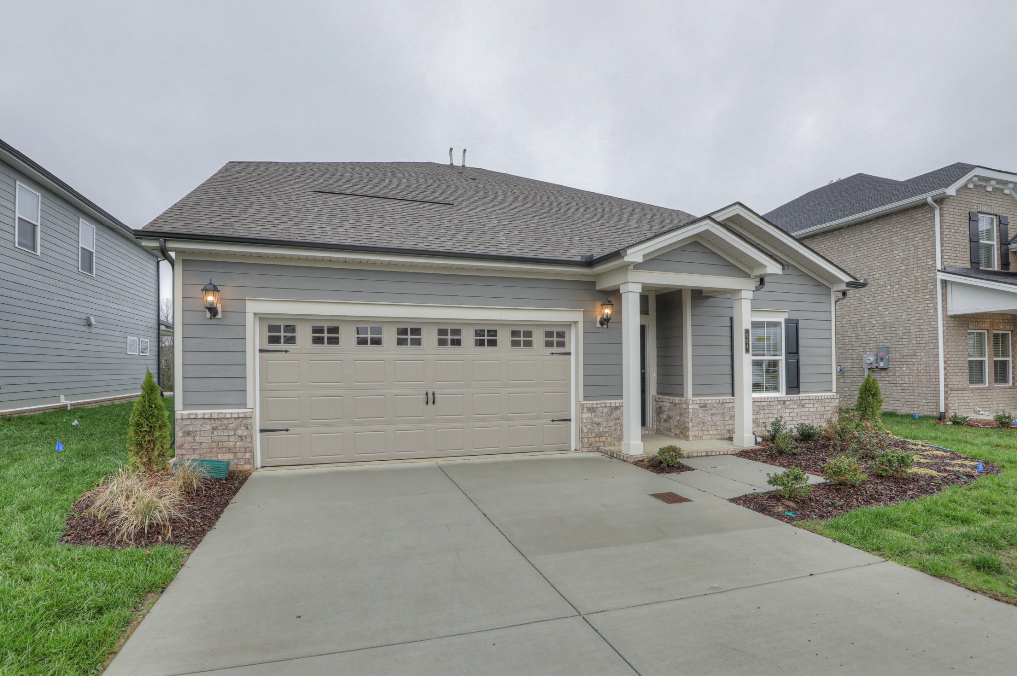 724 Castle Road Mount Juliet, TN 37122 - Photo 3 of 52 a front view of a house with garden