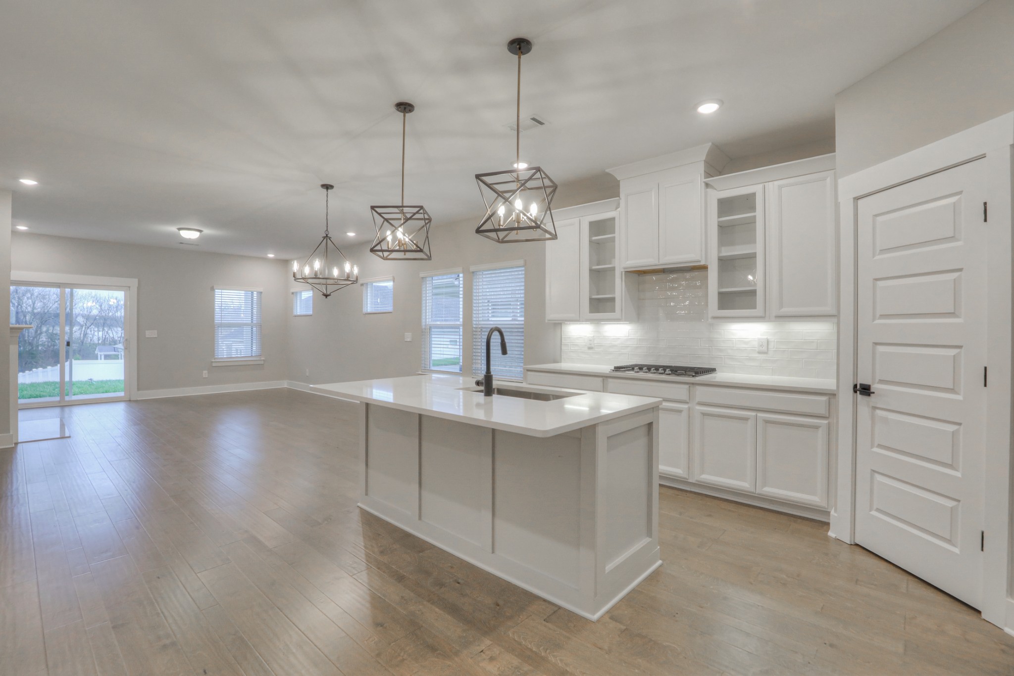 724 Castle Road Mount Juliet, TN 37122 - Photo 8 of 52 a kitchen with stainless steel appliances granite countertop a sink a window and white cabinets