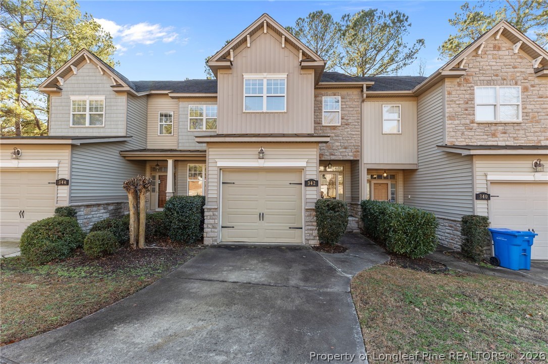 342 Bahama Loop Fayetteville, NC 28314 - Photo 1 of 47 a front view of a house with a yard and garage