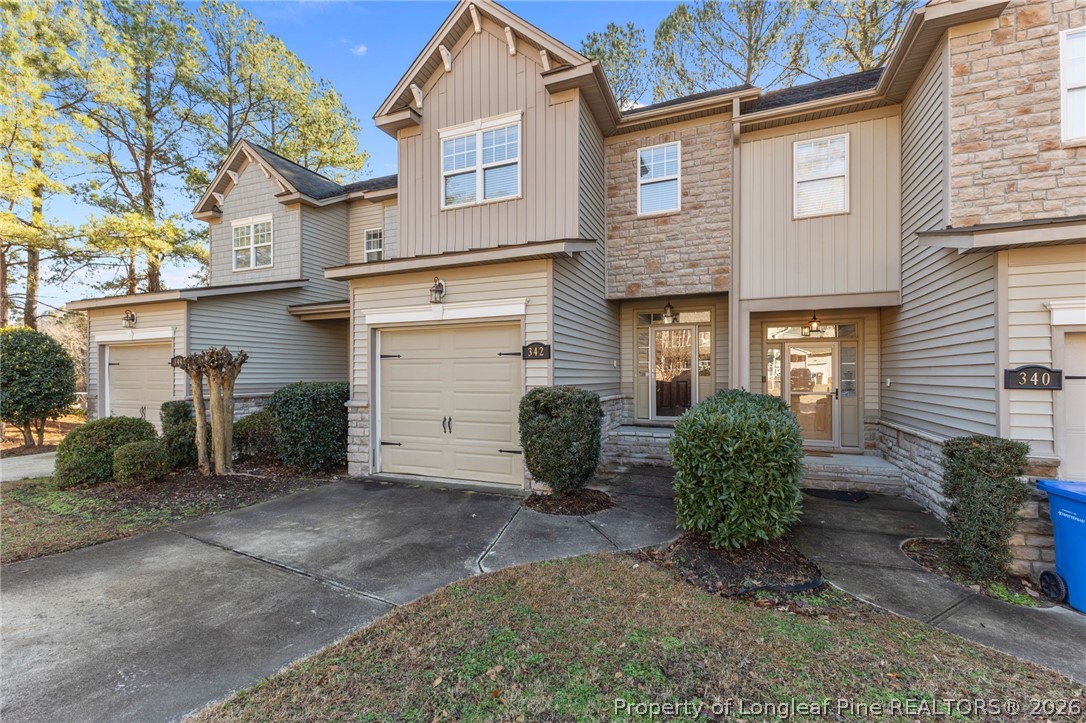 342 Bahama Loop Fayetteville, NC 28314 - Photo 2 of 47 a view of a brick house with many windows and yard