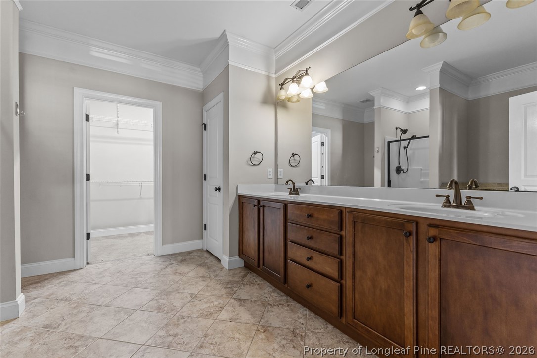 342 Bahama Loop Fayetteville, NC 28314 - Photo 28 of 47 a spacious bathroom with a double vanity sink a mirror and a shower
