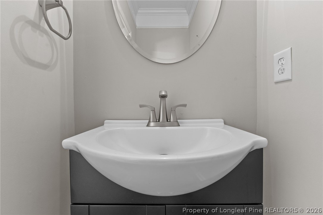 342 Bahama Loop Fayetteville, NC 28314 - Photo 5 of 47 a bathroom with a sink and a mirror
