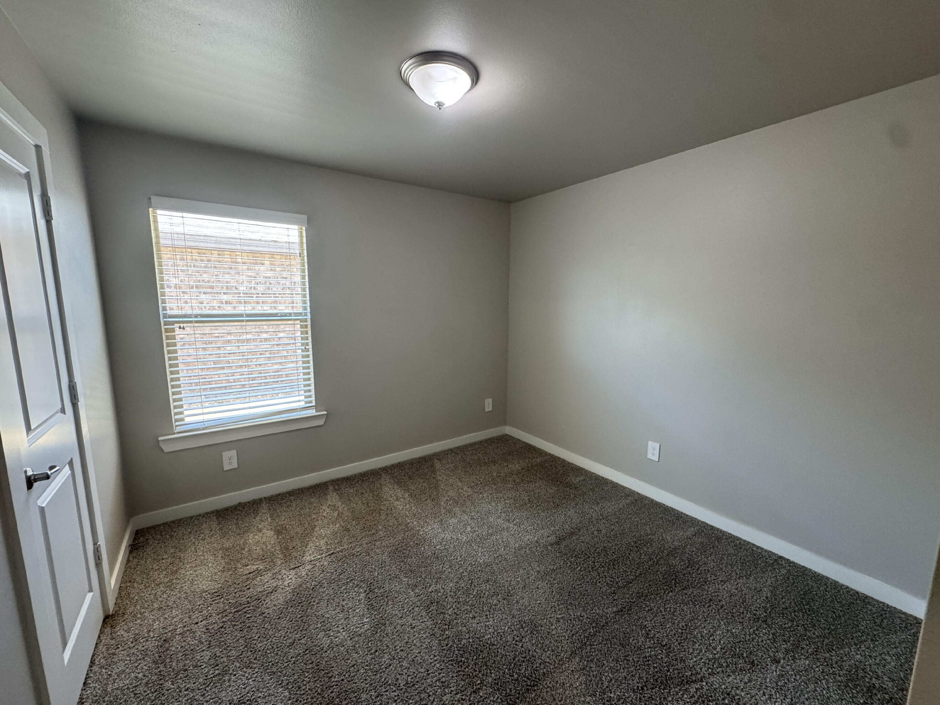 4701 126th Street Lubbock, TX 79424 - Photo 7 of 13 an empty room with a window