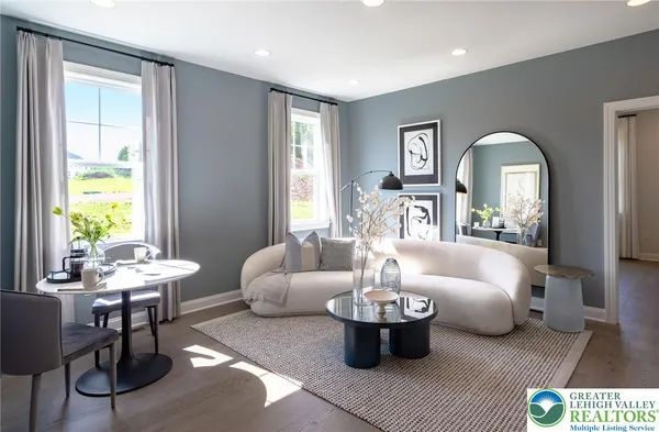 a living room with furniture and a large window