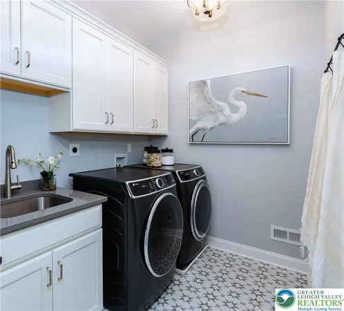 a view of hallway with washer and dryer