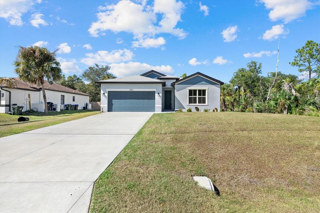 3883 Dominic Street North Port, FL 34288 - Photo 2 of 24 a house view with a garden space