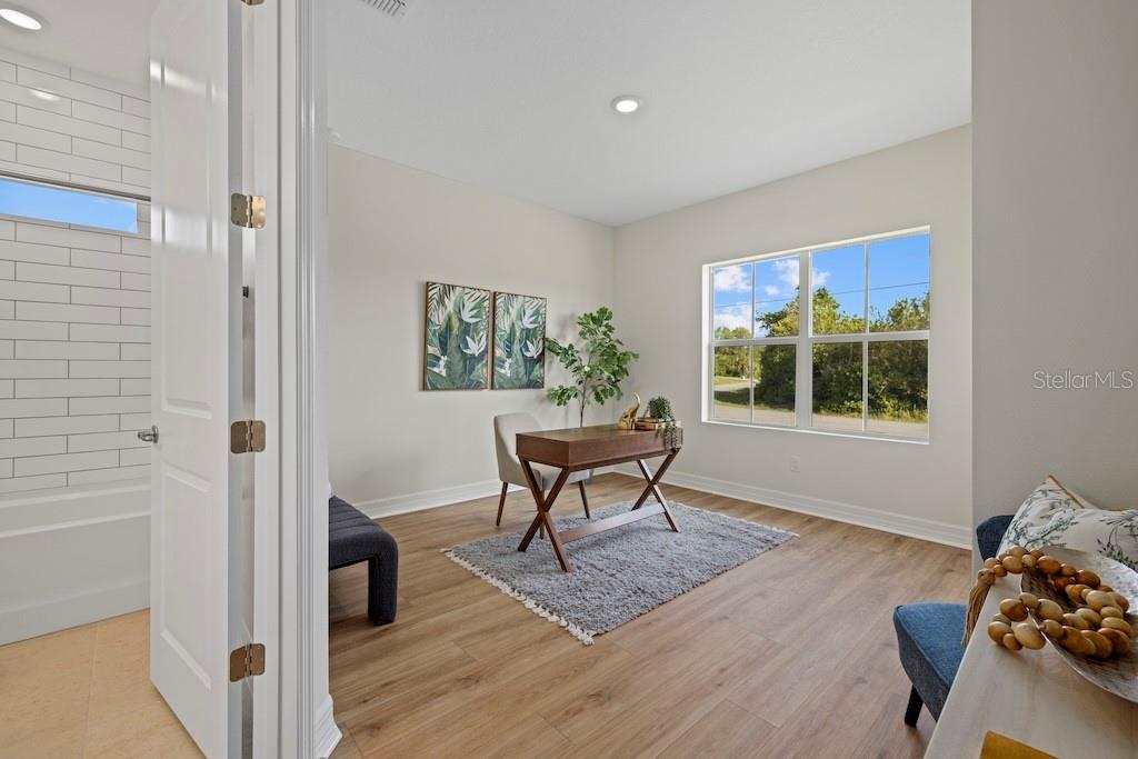 3883 Dominic Street North Port, FL 34288 - Photo 8 of 24 a living room with furniture and a window