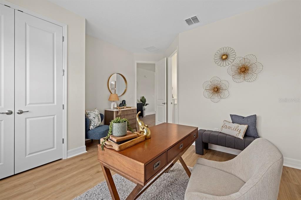 3883 Dominic Street North Port, FL 34288 - Photo 10 of 24 a living room with furniture and a wooden floor