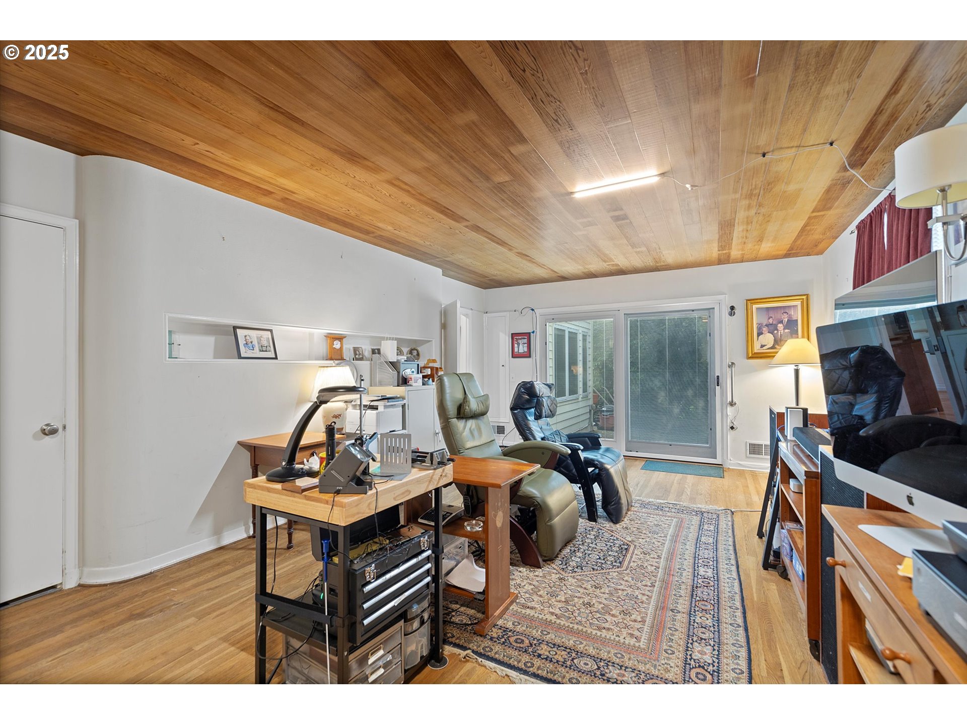 1757 Southwest Prospect Drive Portland, OR 97201 - Photo 18 of 48 a bedroom with furniture and a window