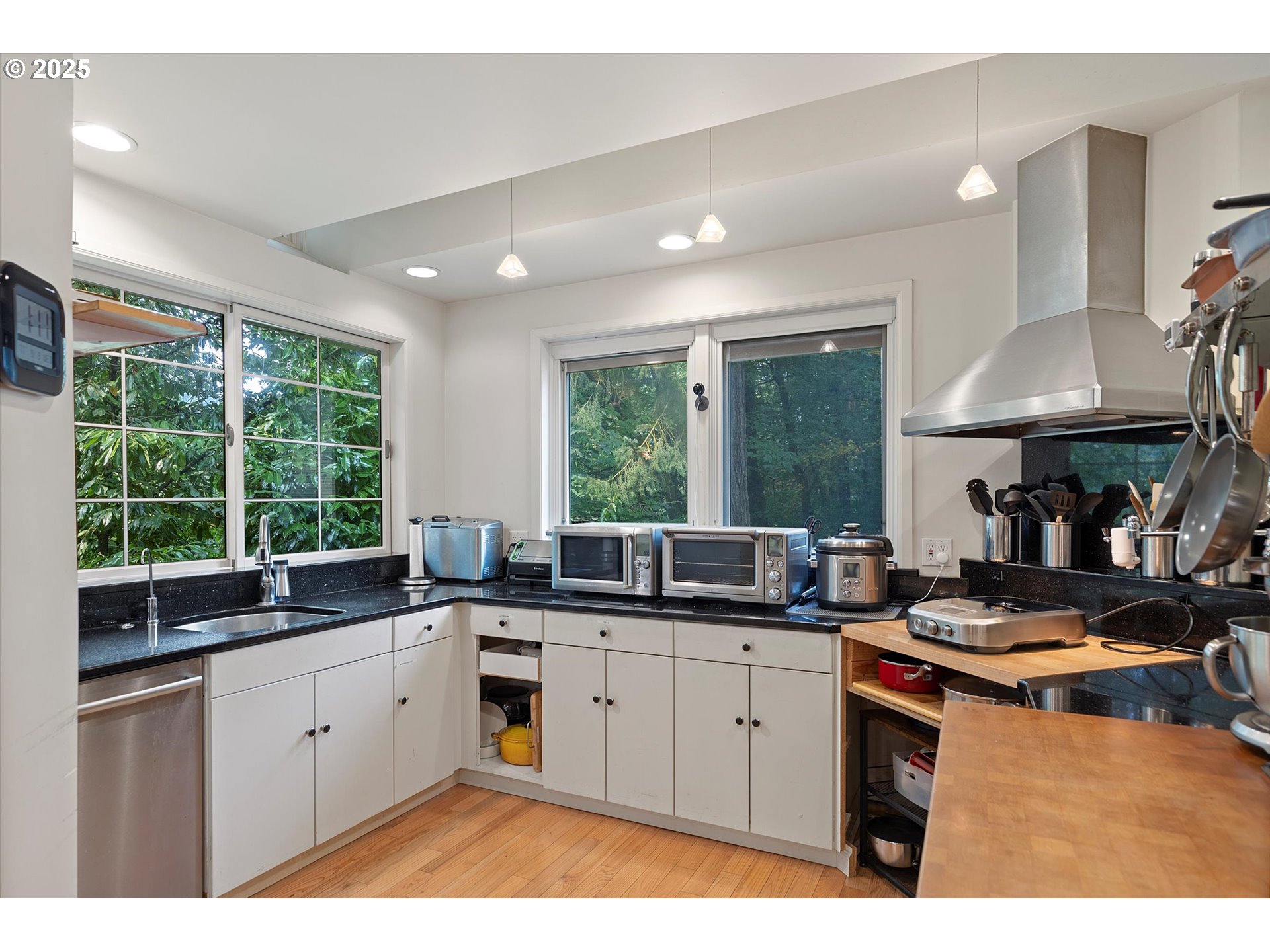 1757 Southwest Prospect Drive Portland, OR 97201 - Photo 19 of 48 a kitchen with a sink stove and cabinets