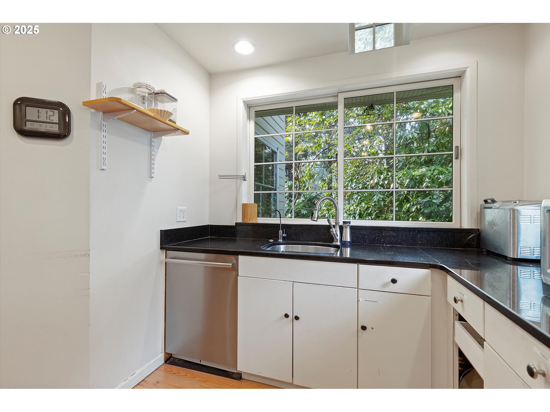 1757 Southwest Prospect Drive Portland, OR 97201 - Photo 21 of 48 a kitchen with granite countertop a sink and a window