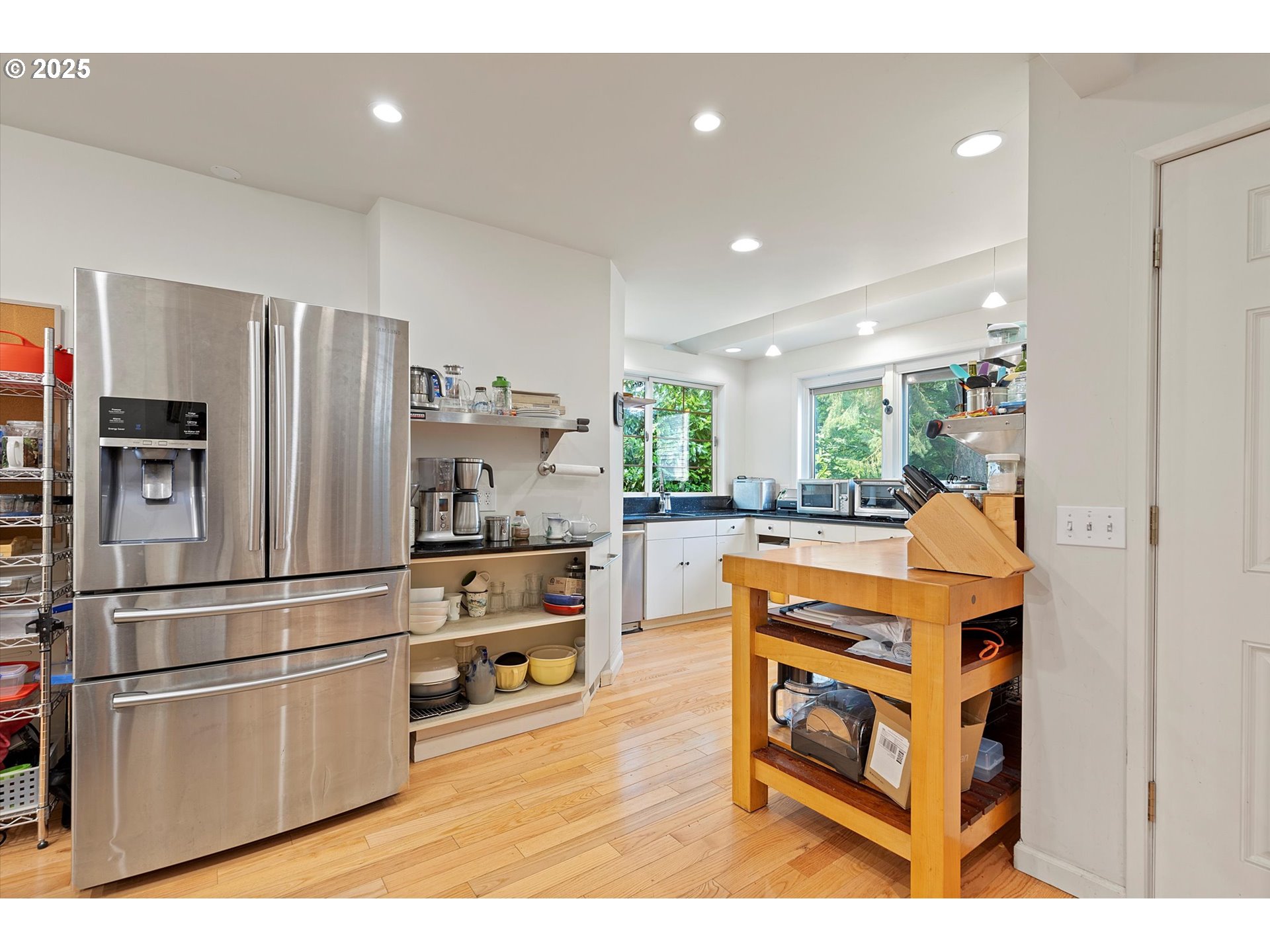 1757 Southwest Prospect Drive Portland, OR 97201 - Photo 22 of 48 a kitchen with stainless steel appliances a refrigerator and a stove top oven
