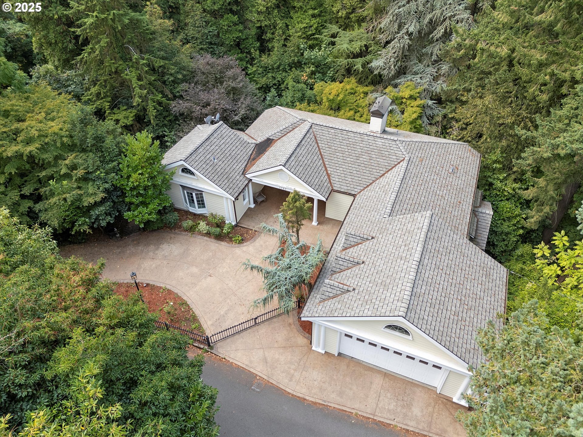 1757 Southwest Prospect Drive Portland, OR 97201 - Photo 43 of 48 an aerial view of a house with yard and mountain view in back