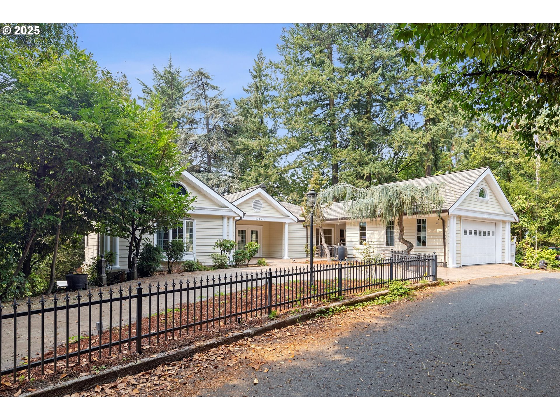 1757 Southwest Prospect Drive Portland, OR 97201 - Photo 48 of 48 a view of a house with a small yard and wooden fence