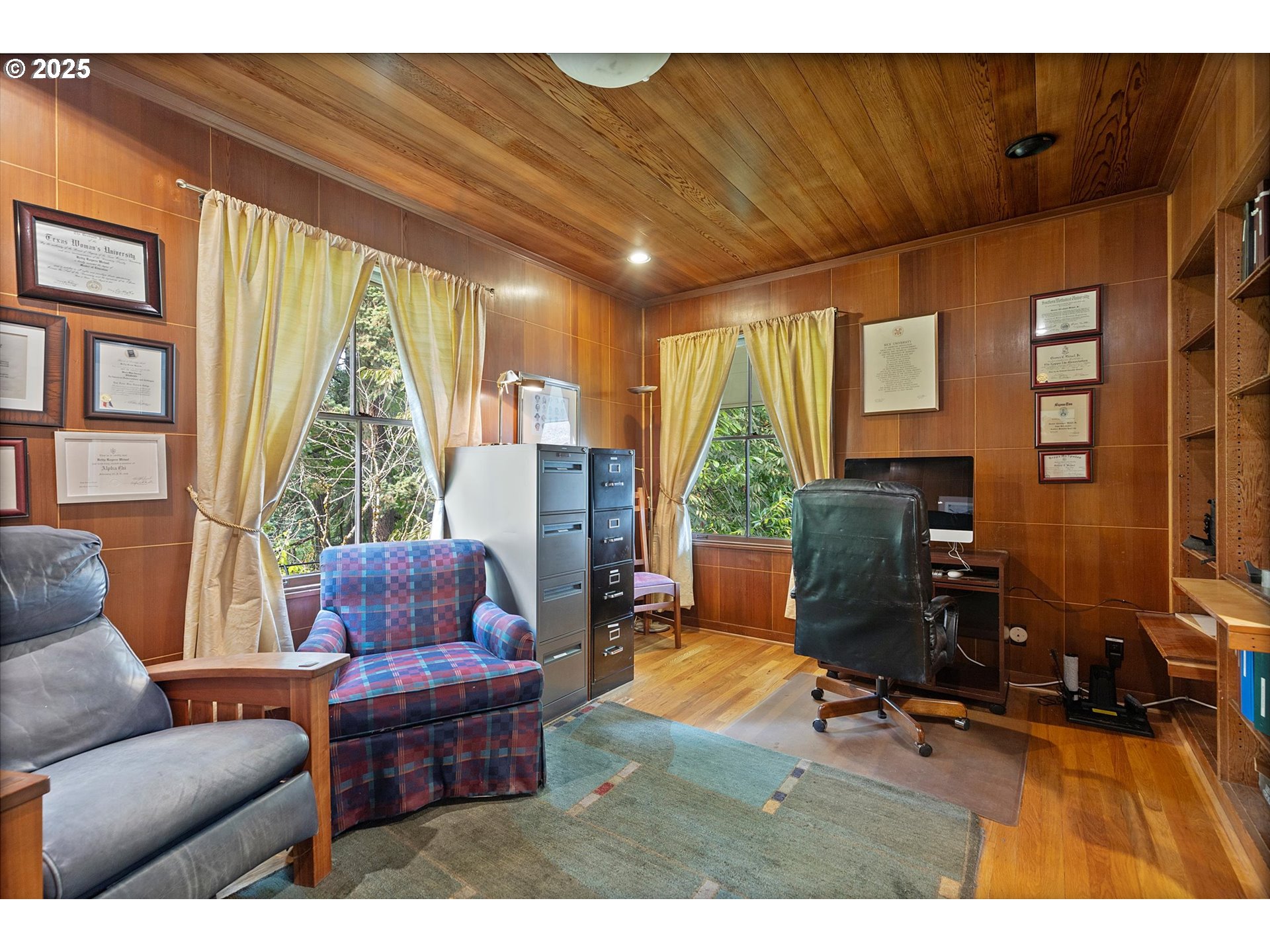 1757 Southwest Prospect Drive Portland, OR 97201 - Photo 5 of 48 a living room with furniture a flat screen tv and a large window