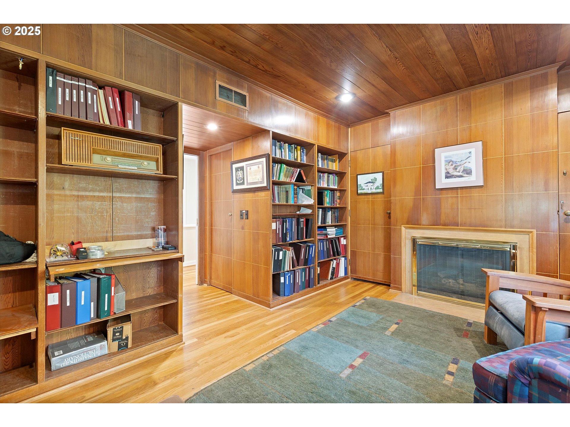 1757 Southwest Prospect Drive Portland, OR 97201 - Photo 7 of 48 a living room with furniture and a bookshelf