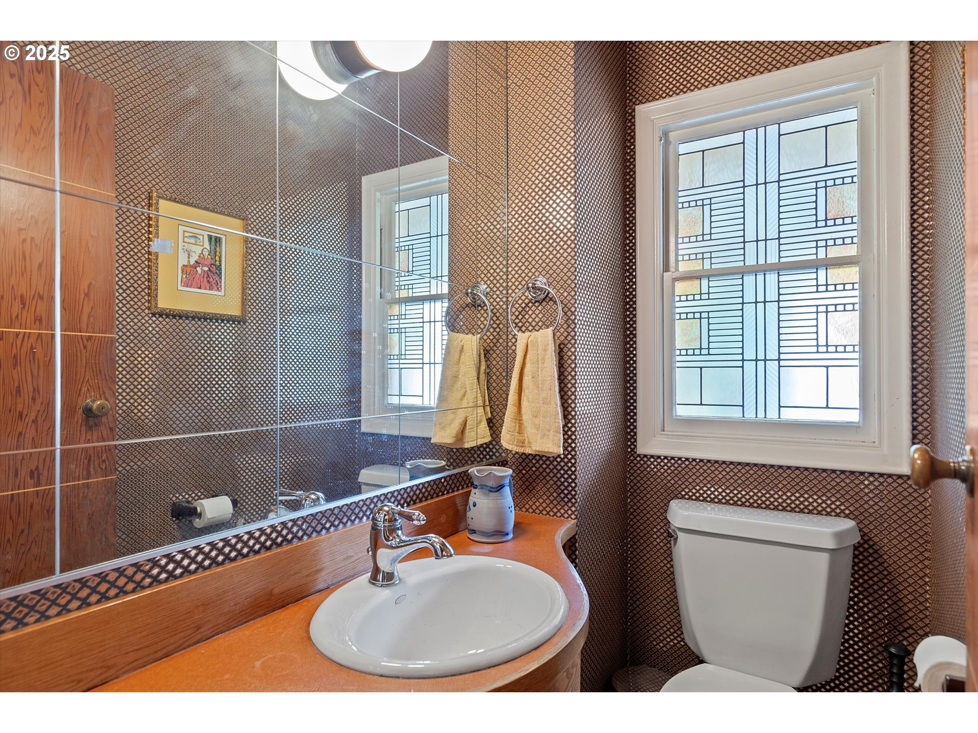 1757 Southwest Prospect Drive Portland, OR 97201 - Photo 8 of 48 a bathroom with a sink a mirror and a window