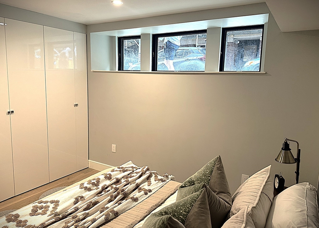 14 North Bennet Street, Unit 1 Boston, MA 02113 - Photo 12 of 20 a bedroom with a bed and a window
