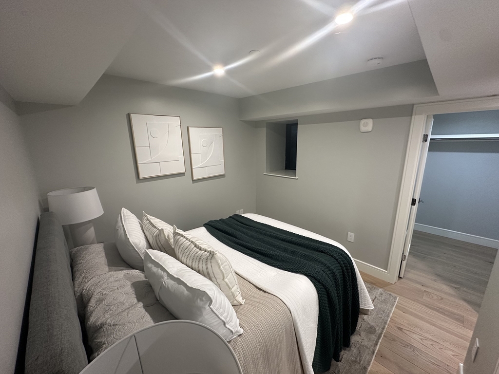 14 North Bennet Street, Unit 1 Boston, MA 02113 - Photo 17 of 20 a bedroom with a bed and a window