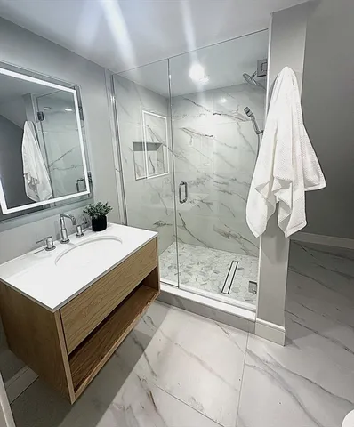 a bathroom with a sink and mirror