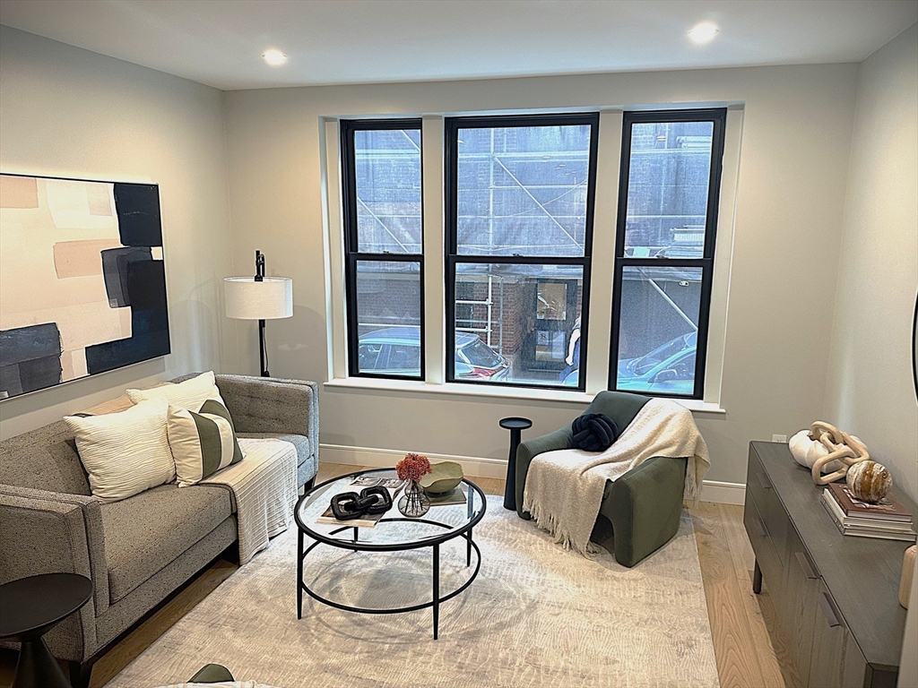14 North Bennet Street, Unit 1 Boston, MA 02113 - Photo 2 of 20 a living room with furniture and a large window