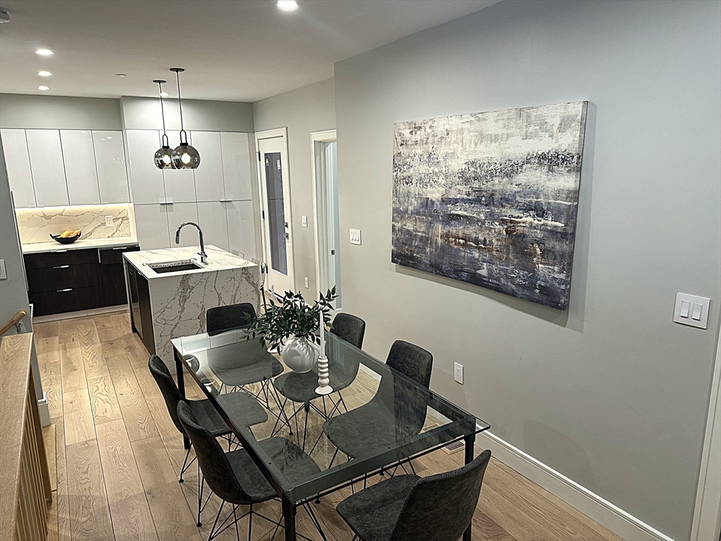 14 North Bennet Street, Unit 1 Boston, MA 02113 - Photo 3 of 20 a view of a dining room with furniture