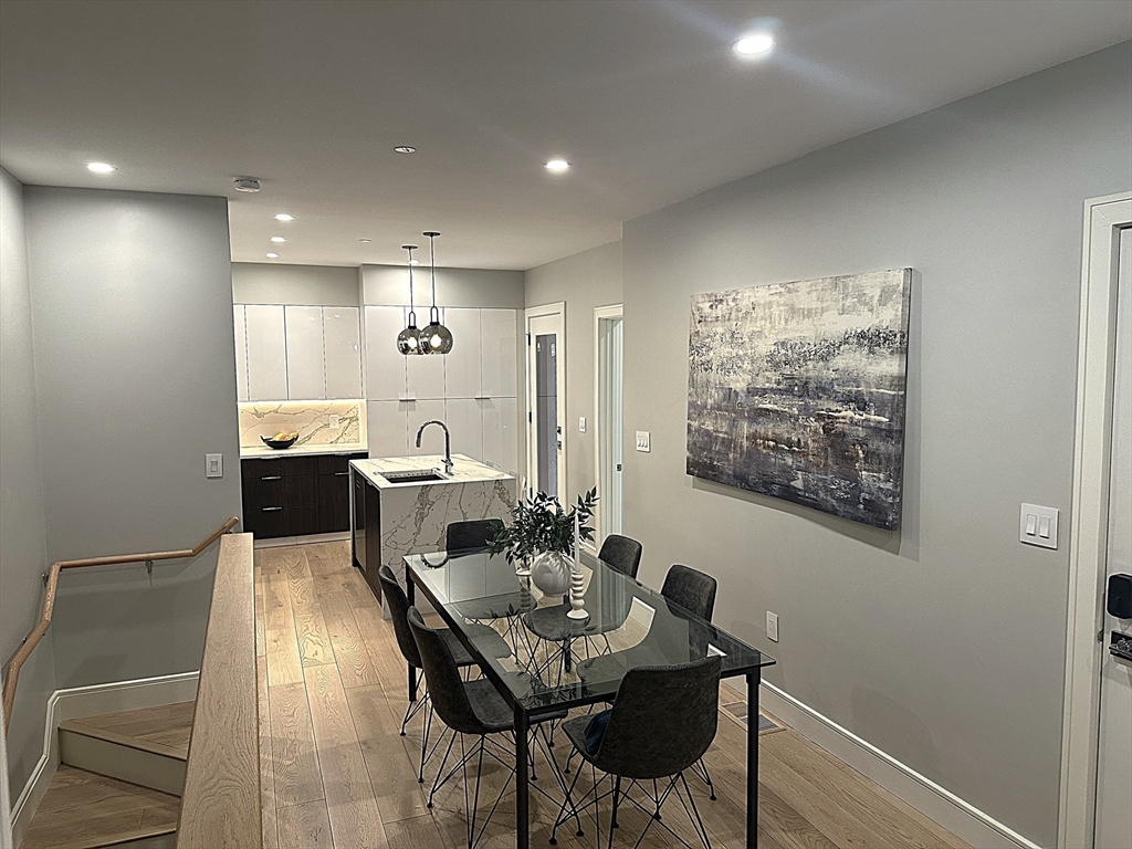 14 North Bennet Street, Unit 1 Boston, MA 02113 - Photo 9 of 20 a view of a dining room with furniture and a potted plant