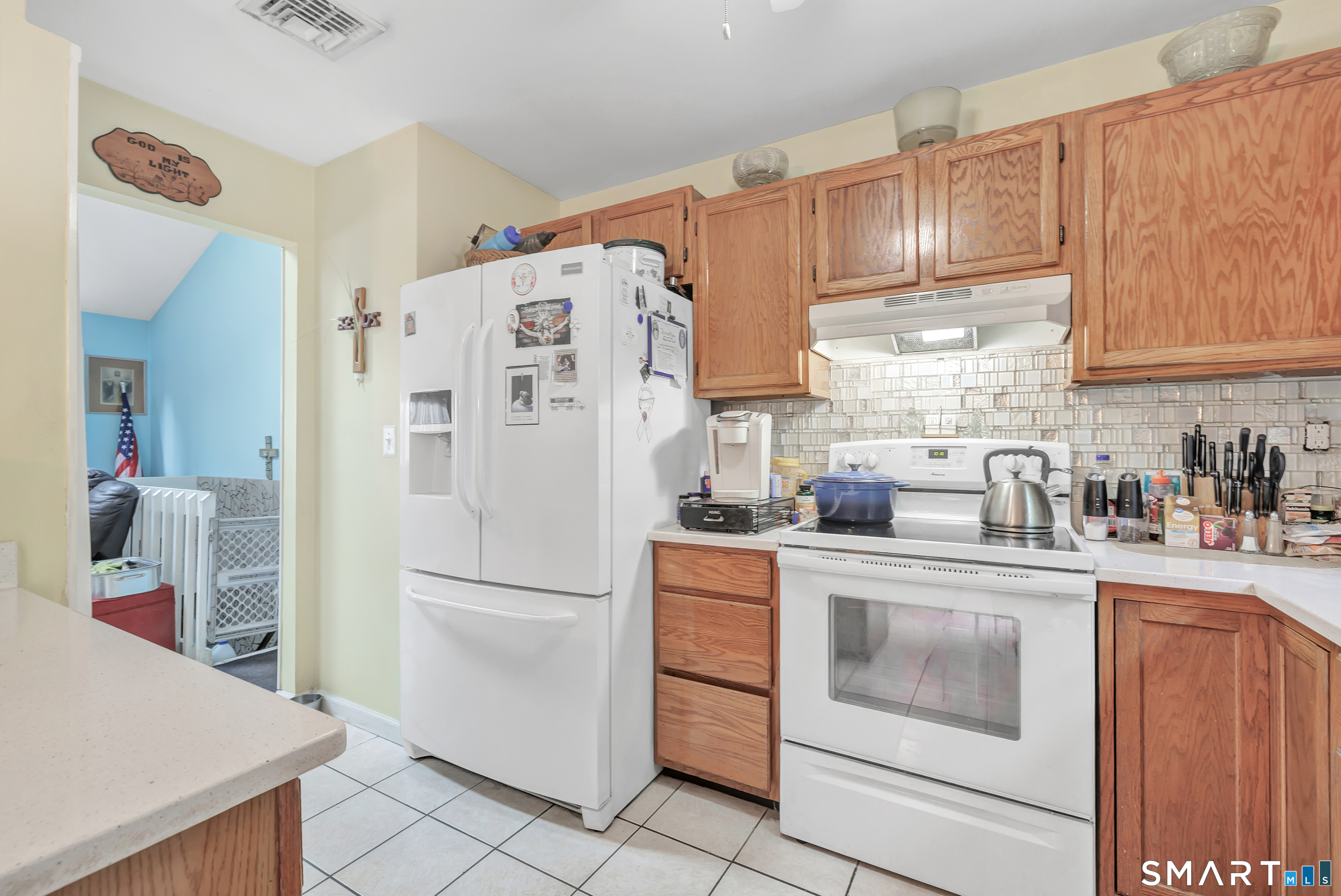 123 River Road Shelton, CT 06484 - Photo 8 of 27 a kitchen with stainless steel appliances granite countertop a refrigerator sink stove and cabinets