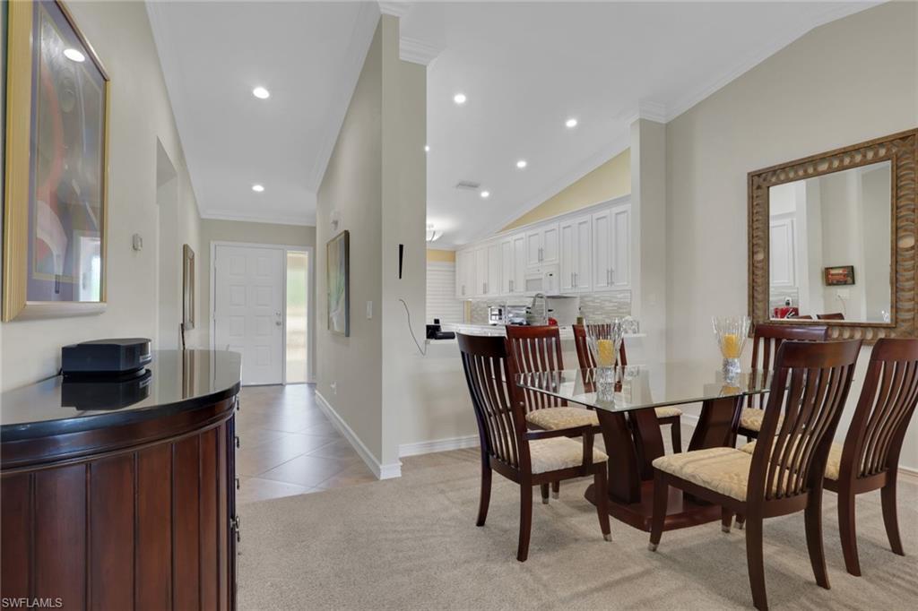 406 Foxtail Court, Unit 406 Naples, FL 34104 - Photo 11 of 42 a view of a dining room with furniture