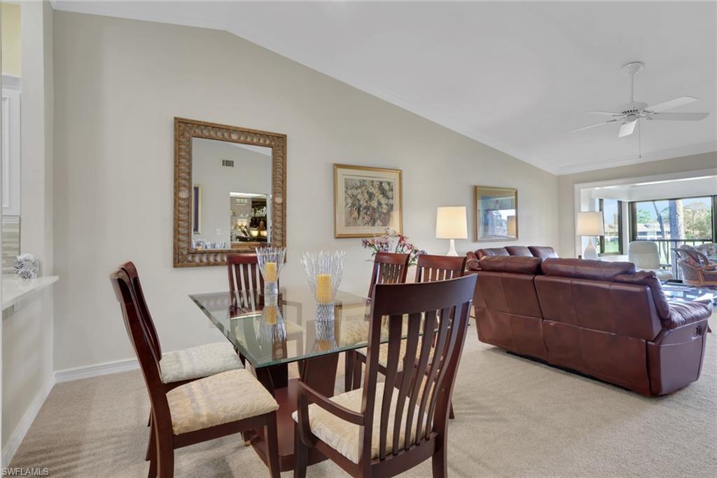 406 Foxtail Court, Unit 406 Naples, FL 34104 - Photo 14 of 42 a view of a dining room with furniture