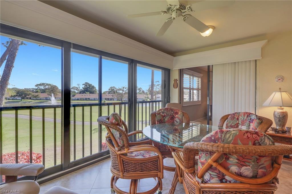406 Foxtail Court, Unit 406 Naples, FL 34104 - Photo 24 of 42 a living room with furniture and a large window