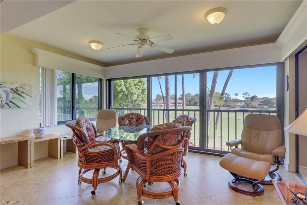 406 Foxtail Court, Unit 406 Naples, FL 34104 - Photo 6 of 42 a living room with furniture and a large window