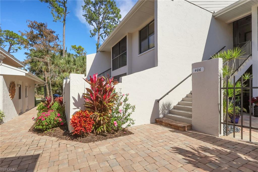 406 Foxtail Court, Unit 406 Naples, FL 34104 - Photo 7 of 42 a view of a potted flower in the corridor
