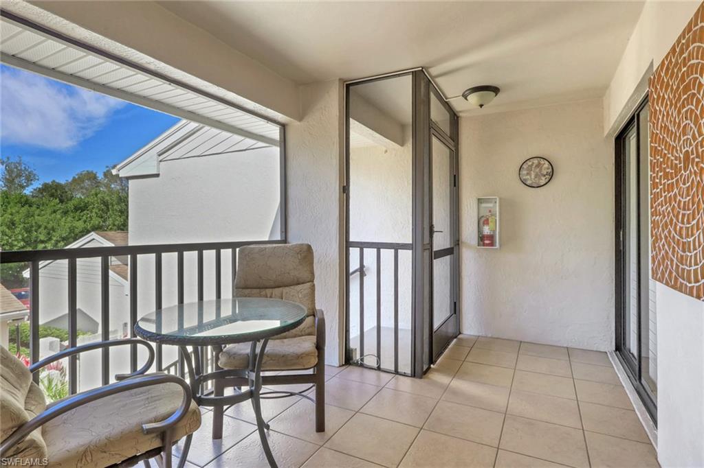 406 Foxtail Court, Unit 406 Naples, FL 34104 - Photo 9 of 42 a view of a hallway and wooden floor