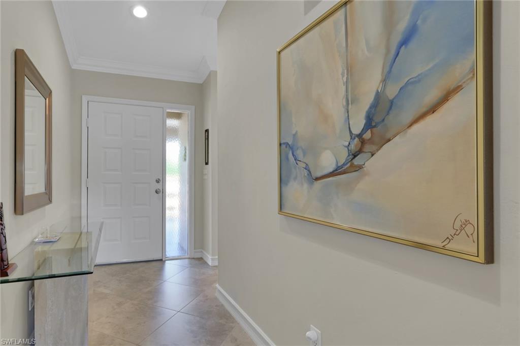 406 Foxtail Court, Unit 406 Naples, FL 34104 - Photo 10 of 42 a view of a hallway with staircase