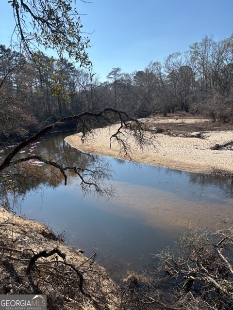 a view of swimming pool with a yard