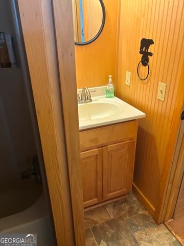 a bathroom with a sink and a mirror