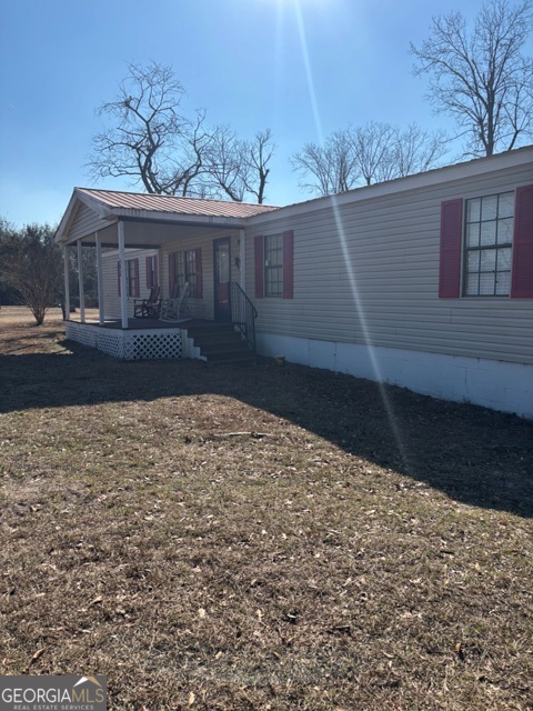 592 Clifford Meeks Road Collins, GA 30421 - Photo 15 of 52 a view of a house with a yard