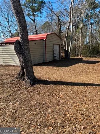 a view of a yard with a tree