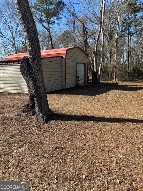 592 Clifford Meeks Road Collins, GA 30421 - Photo 21 of 52 a view of a yard with a tree