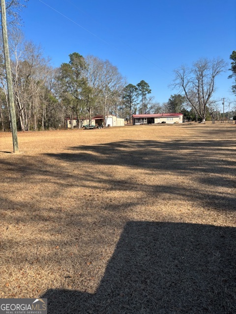 592 Clifford Meeks Road Collins, GA 30421 - Photo 29 of 52 a view of an ocean with a nearby beach
