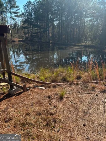 a view of a lake with a yard