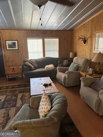 a living room with furniture and a window