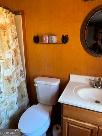 a bathroom with a toilet and a sink