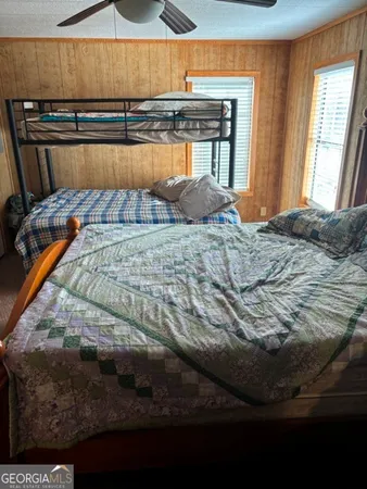 a bedroom with a bed and dresser