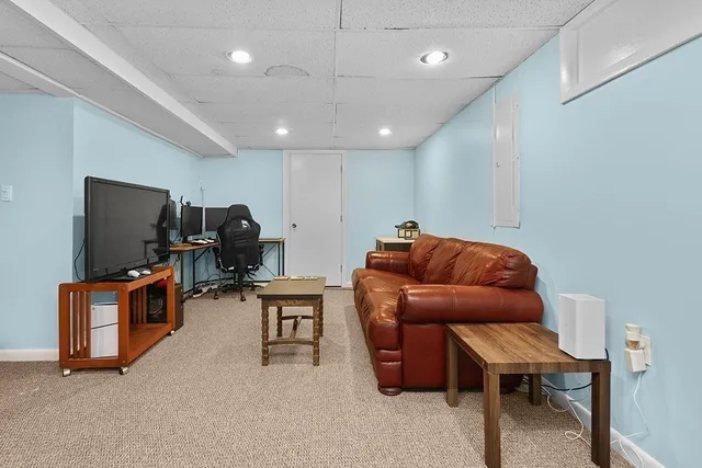 a room with furniture and a flat screen tv