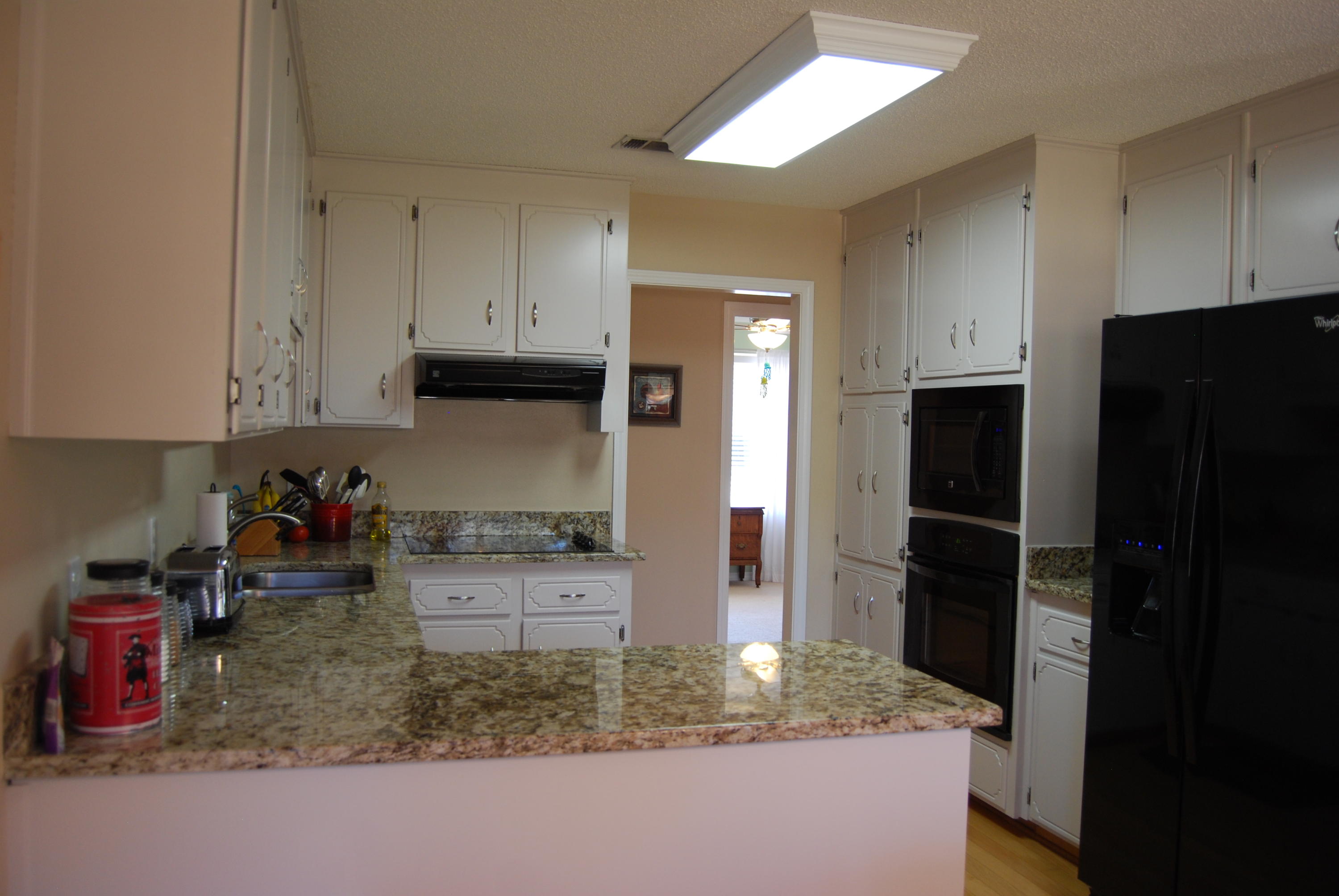 4455 Kingslynn Road Niceville, FL 32578 - Photo 11 of 36 a kitchen with stainless steel appliances granite countertop a refrigerator and a sink