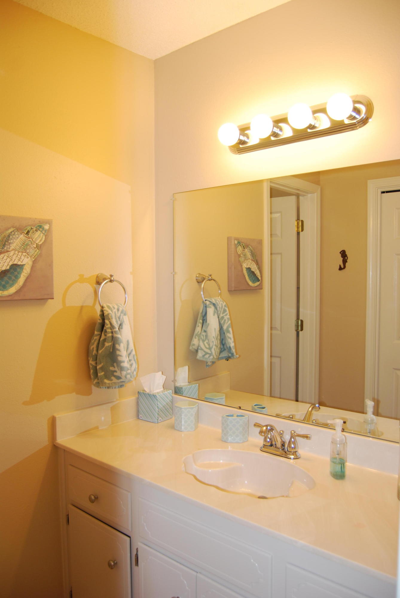 4455 Kingslynn Road Niceville, FL 32578 - Photo 25 of 36 a bathroom with a granite countertop sink and a mirror
